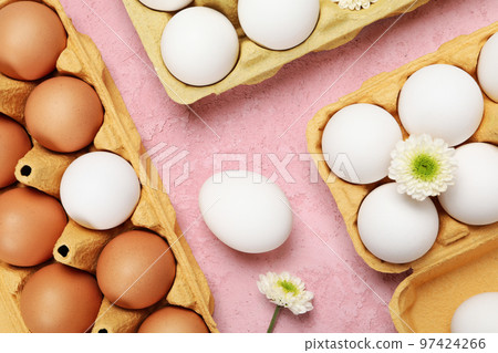 Concept of spring, eggs with flowers, top view Concept of spring, eggs with flowers, top view 97424266