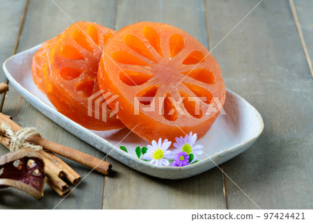 Candied Bael in dish on wood background, dessert food Candied Bael in dish on wood background, dessert food 97424421