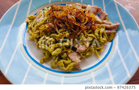 A dish of homemade spaetzle or german egg noodle dumplings A dish of homemade spaetzle or german egg noodle dumplings 97426375