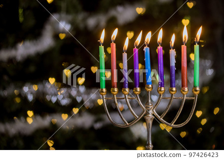 Jewish culture holiday symbol, candles are lit on Hanukkiah Menorah to represent Hanukkah symbol of Jewish religion Jewish culture holiday symbol, candles are lit on Hanukkiah Menorah to represent Hanukkah symbol of Jewish religion 97426423