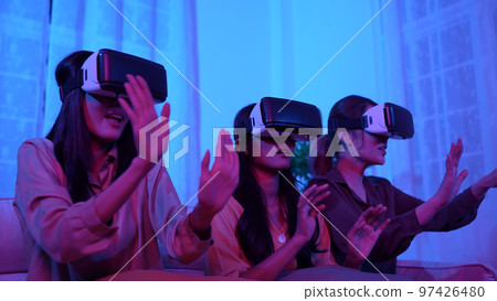 Holiday concept of 4k Resolution. Asian women use vr together in the living room. virtual reality technology. Holiday concept of 4k Resolution. Asian women use vr together in the living room. virtual reality technology. 97426480