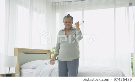 Exercise concept of 4k Resolution. Asian elderly woman exercising at home. Exercise concept of 4k Resolution. Asian elderly woman exercising at home. 97426489
