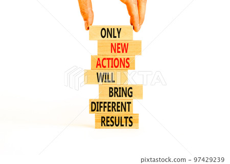 New action symbol. Concept words Only new actions will bring different results on wooden blocks. Beautiful white background copy space. Businessman hand. Business new action and result concept. New action symbol. Concept words Only new actions will bring different results on wooden blocks. Beautiful white background copy space. Businessman hand. Business new action and result concept. 97429239