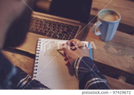 Cropped image of casual business man or freelancer planning his Cropped image of casual business man or freelancer planning his 97429672