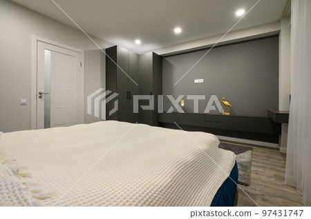 Modern master bedroom with trendy gray and white interior 97431747