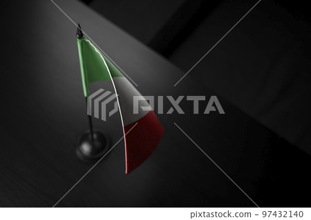 Small national flag of the Italy on a black background 97432140