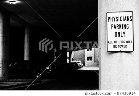 Physician parking sign posted outside of garage and hospital entrance Physician parking sign posted outside of garage and hospital entrance 97436914