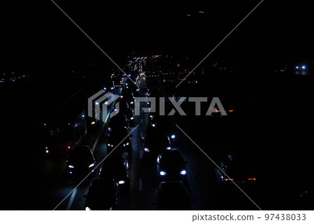 Kyiv, Ukraine - December 16, 2022: Blackout in the Ukrainian capital Kyiv. Capital streets without street lighting. Only the lights of passing cars are visible Kyiv, Ukraine - December 16, 2022: Blackout in the Ukrainian capital Kyiv. Capital streets without street lighting. Only the lights of passing cars are visible 97438033