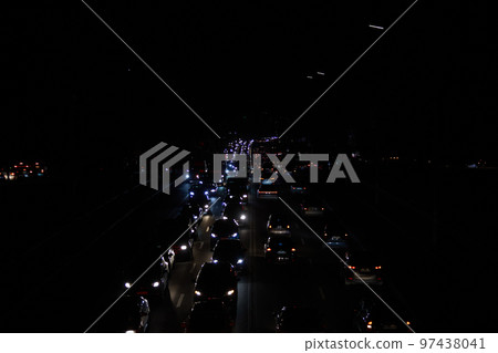 Kyiv, Ukraine - December 16, 2022: Blackout in the Ukrainian capital Kyiv. Capital streets without street lighting. Only the lights of passing cars are visible Kyiv, Ukraine - December 16, 2022: Blackout in the Ukrainian capital Kyiv. Capital streets without street lighting. Only the lights of passing cars are visible 97438041
