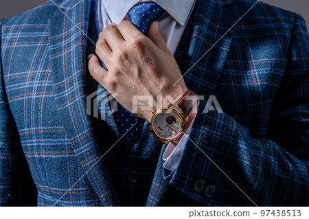 closeup of businessperson in wristwatch. businessperson wearing wristwatch. photo of businessperson closeup of businessperson in wristwatch. businessperson wearing wristwatch. photo of businessperson 97438513