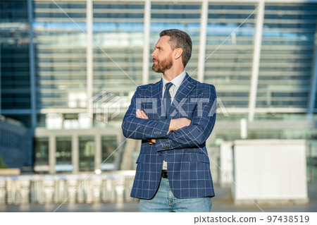 confident ceo in formalwear. adult ceo outdoor. ceo in jacket. caucasian ceo standing outside 97438519