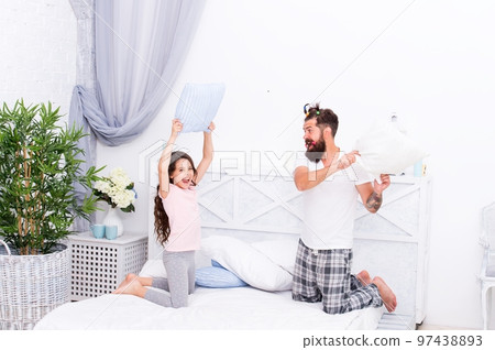 Real feelings. playing together in free time. funny hair styling. entertainment. father and daughter having fun. kid and dad fighting with pillows. happy family day. celebrate fathers day 97438893