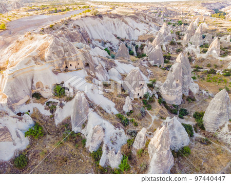Beautiful stunning view of the mountains of Cappadocia and cave houses. Turkey Beautiful stunning view of the mountains of Cappadocia and cave houses. Turkey 97440447