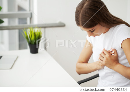 Health problems, beautiful woman suffering from heart pain. 97440884