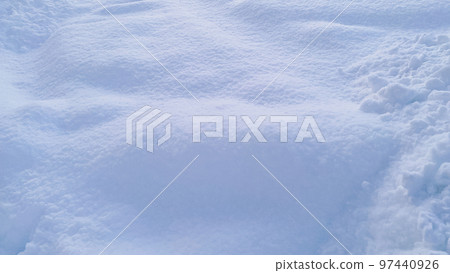 Natural winter background from snow falling on the ground Natural winter background from snow falling on the ground 97440926