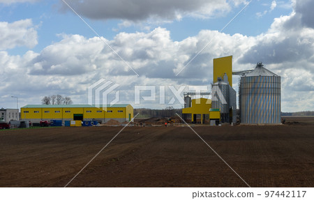 A modern granary in a field in a suburb of Vilnius in early spring. A modern granary in a field in a suburb of Vilnius in early spring. 97442117