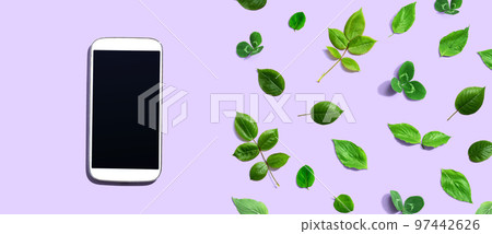 White smartphone with green leaves White smartphone with green leaves 97442626