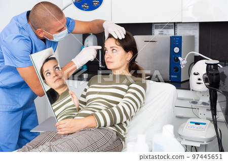 Woman having consultation with doctor in clinic Woman having consultation with doctor in clinic 97445651