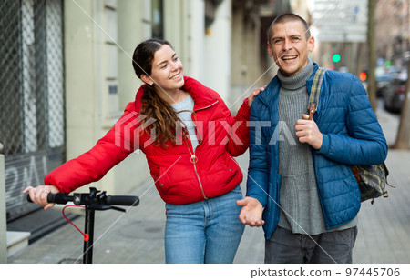 young couple man and woman walking outdoors young couple man and woman walking outdoors 97445706