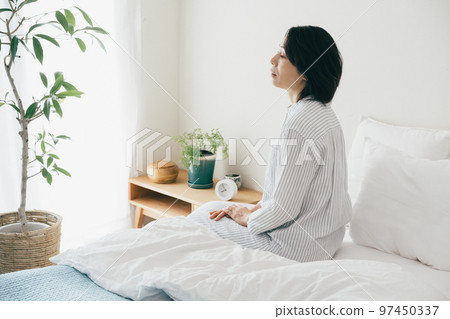 sleep-deprived middle-aged woman 97450337