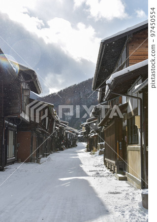 Nakasendo Kisoji Narai-juku with a snowy landscape 97450554