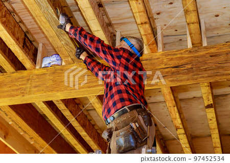 Using cement glue for construction of residential home plumber gluing PVC pipes together to join plastic pipes 97452534