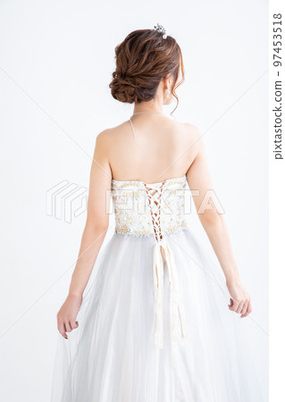 Back view of a woman in a dress dress 97453518