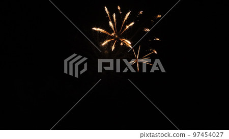 fireworks sky. fireworks cheerful holiday birthday. christmas eve. happy holiday new year. christmas multicolored light sky. colorful holiday golden shining fireworks. background real fireworks night 97454027