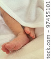 0 month old newborn baby's tiny feet with desquamation 97455101