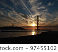 Sunset over the Akashi Kaikyo Bridge with beautiful autumn clouds seen in the Seto Inland Sea 97455102
