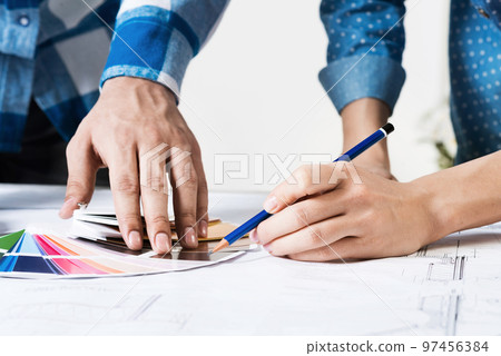Designers selecting color palette for project Designers selecting color palette for project 97456384