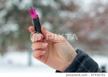 Flash Noise Firecracker in a Hand Flash Noise Firecracker in a Hand 97456791