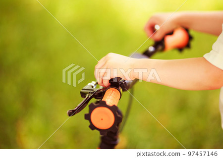 Boy with a bicycle on the street Boy with a bicycle on the street 97457146