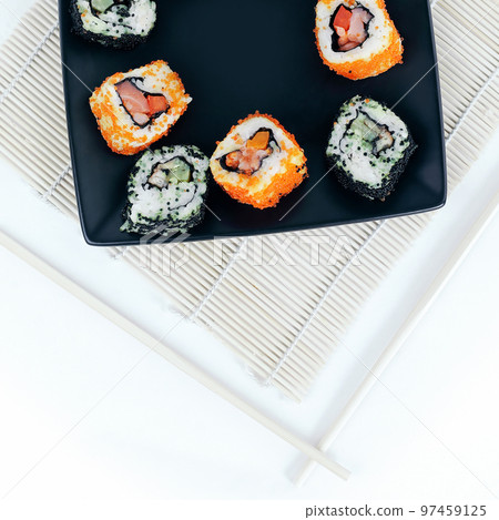 different types of Maki sushi on a black plate different types of Maki sushi on a black plate 97459125