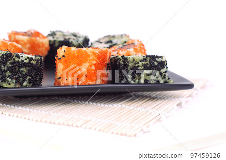 different types of Maki sushi on a black plate 97459126