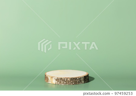 Wood slice podium on green background for cosmetic product mockup Wood slice podium on green background for cosmetic product mockup 97459253