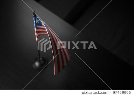 Small national flag of the Liberia on a black background Small national flag of the Liberia on a black background 97459966