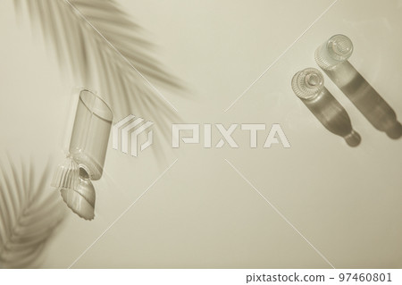 Natural shadow background with glass bottle flower palm trees 97460801