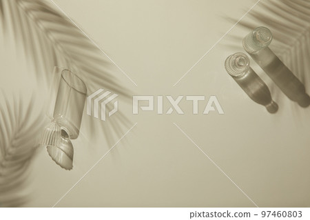 Natural shadow background with glass bottle flower palm trees Natural shadow background with glass bottle flower palm trees 97460803