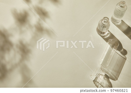 Natural shadow background with glass bottle flower palm trees Natural shadow background with glass bottle flower palm trees 97460821