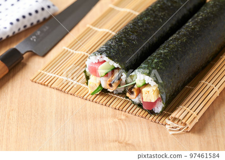 Ehomaki rolls arranged on a bamboo screen (Ingredients: tuna, boiled conger eel, cucumber, omelet, perilla, shrimp.) Ehomaki rolls arranged on a bamboo screen (Ingredients: tuna, boiled conger eel, cucumber, omelet, perilla, shrimp.) 97461584