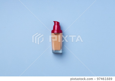Liquid foundation tube on blue background close up 97461889