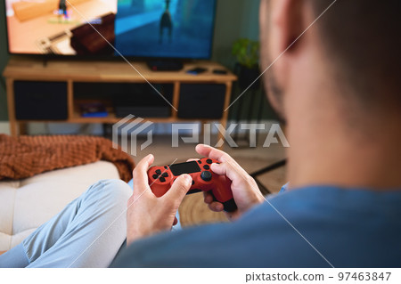 Son and father playing video game at home, Family spending time together, Happy relationship, Online entertainment and leisure activity 97463847