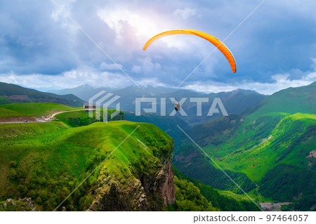 Aerial view of Russia Georgia friendship monument on the georgian military road at the Jvari pass, Georgia. 97464057