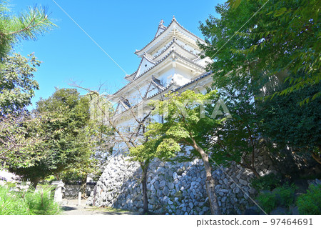 The castle tower and stone walls of Ogaki Castle in sunny Mino Province 97464691