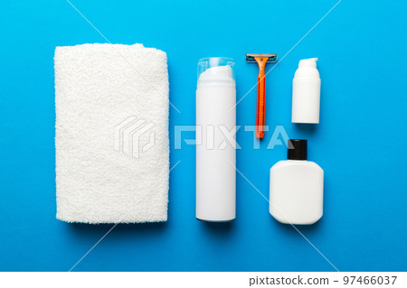 shaving man set. shaving machine, towel, lotion and shaving foam on colored background. Men bath Accessories top view 97466037