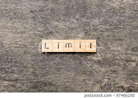 limit word written on wood block. limit text on table, concept 97466280