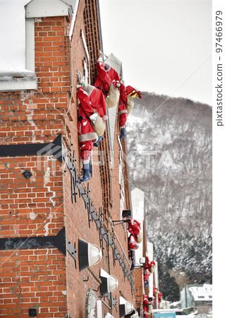 Shoot the scenery of Kanemori Warehouse and Santa Claus objects in the bay area of Hakodate, Hokkaido in winter 97466979