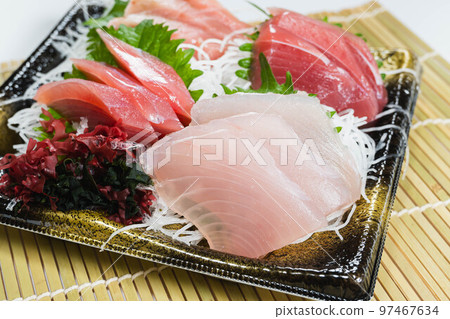 sliced raw fish 97467634