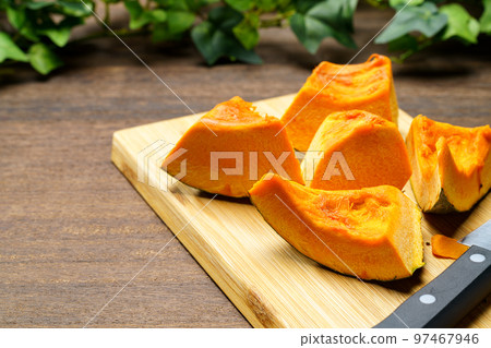 Cut pumpkin on a cutting board Cut pumpkin on a cutting board 97467946